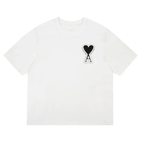 https://cdn.shopify.com/s/files/1/0901/0413/6028/files/ami-heart-tee-651173.webp?v=1743324148